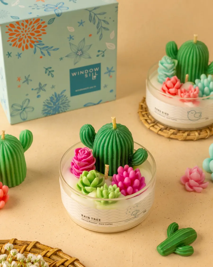 Mini Cactus Garden Candle in a glass jar by Windowsill, with cactus and floral designs, floral packaging, showcasing biophilia-inspired decor.